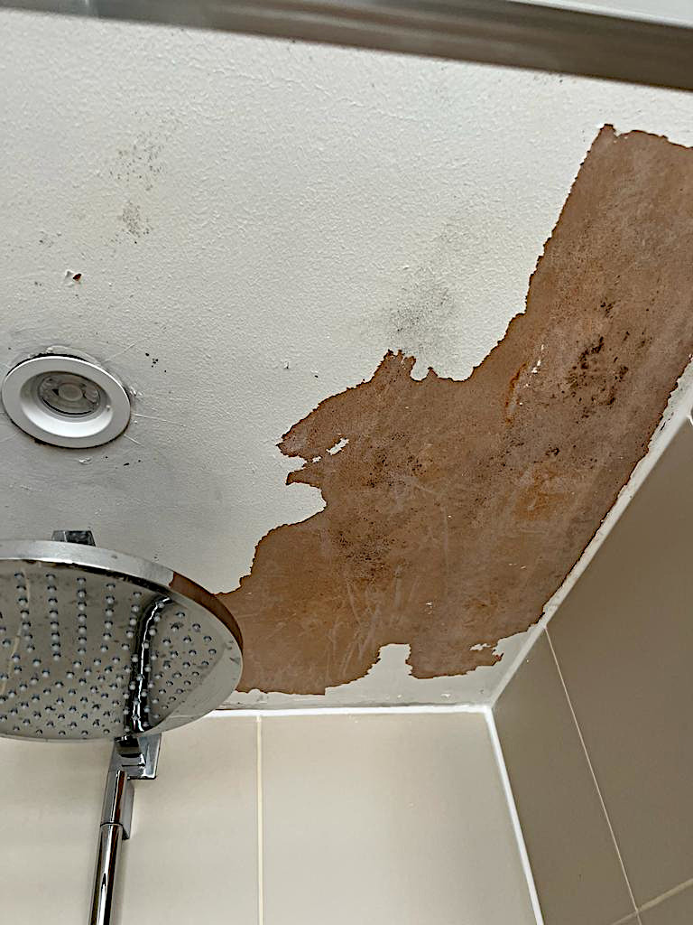 Painting and resealing of water damaged and peeling paint in bathroom. Finchley Central - before